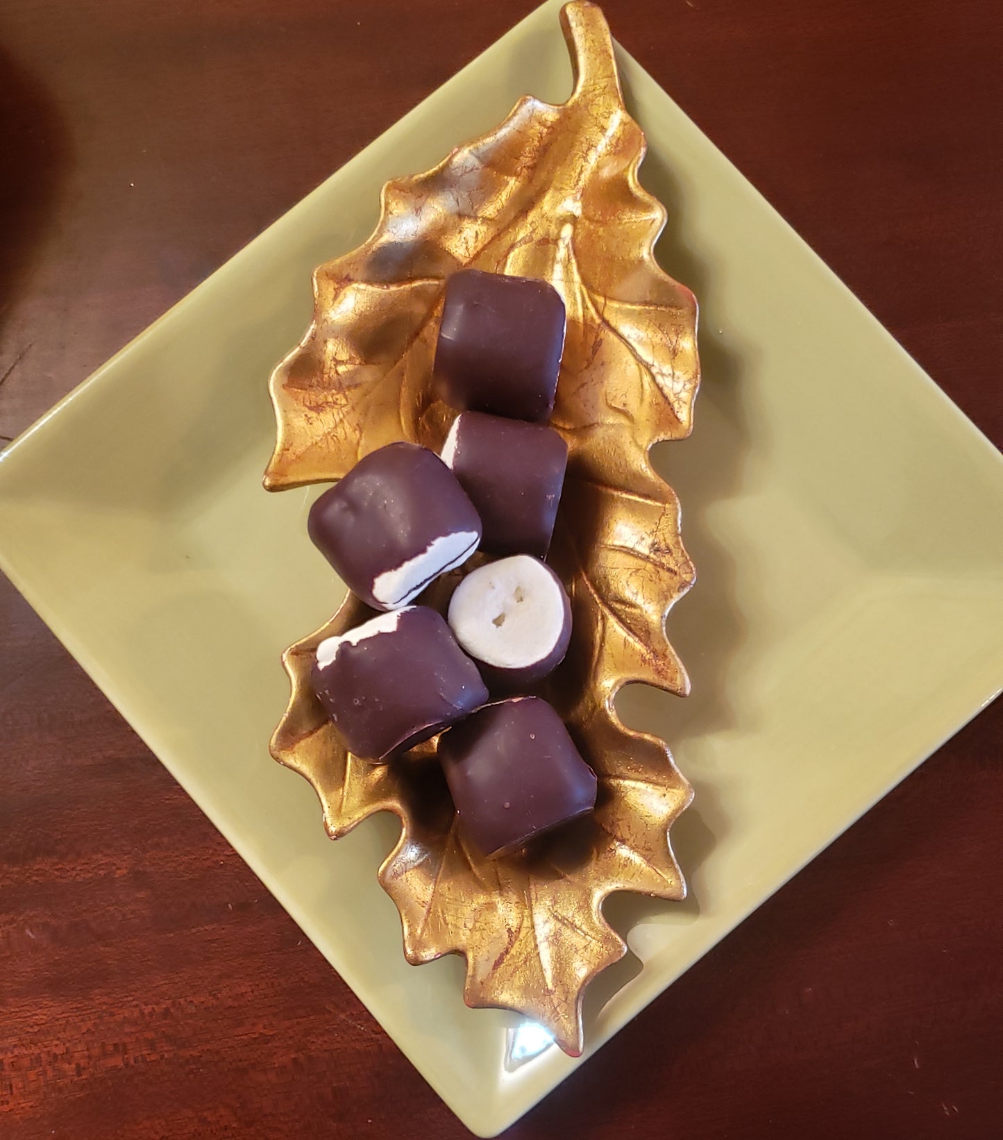 
                  
                    6 chocolate covered marshmallows on plate
                  
                